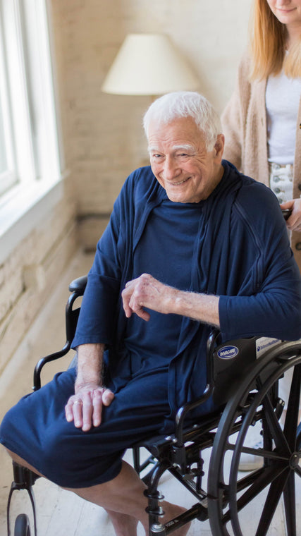Load image into Gallery viewer, Wheelchairs and accessibility bring new life to our modern patients using the Arkeras hospital gown. Feel the fresh Arkeras patient difference with each gift you give, hospice or home healthcare.