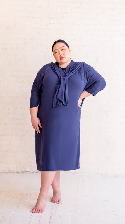 Load image into Gallery viewer, Shown on the ever popular young model, the Arkeras gown is size inclusive with a range of size options and overlapping back panels to preserve modesty while recovering in the hospital or lounging at the medi-spa. Clinical hospital gowns can be beautiful hospital gown.