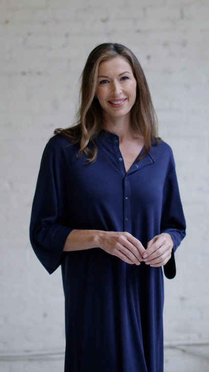 Load image into Gallery viewer, Woman wearing cotton hospital patient gown in dark blue Henley style front