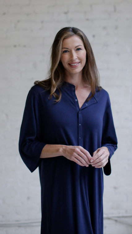 Load image into Gallery viewer, Woman wearing cotton hospital patient gown in dark blue Henley style front
