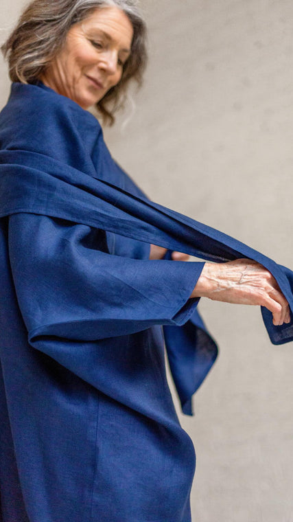 Load image into Gallery viewer, patient wraps hospital gown in blue linen fabric