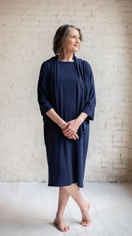Load image into Gallery viewer, Beautiful hospital gowns are better than pretty hospital gowns for many reasons. Arkeras patient gowns are the best example of beautiful hospital gown because of it's functionality and medical access points: chest zippers, overlapping back panels, and range of motion sleeves. We designed this blue hospital gown with dignity in mind and truly want to help with positive patient outcomes in their medical prognosis. Albeit maternity care or hospice, purchase hospital gowns with Arkeras elegance and style.